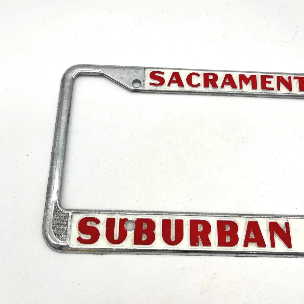 Vintage Suburban Ford Sacramento License Plate Frame Chrome Red White Metal